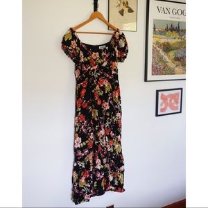 Listicle. Large, black, floral midi dress.
